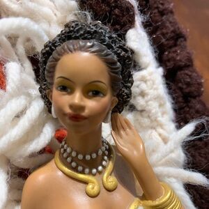 Elegant Figurine with Pearl Necklace